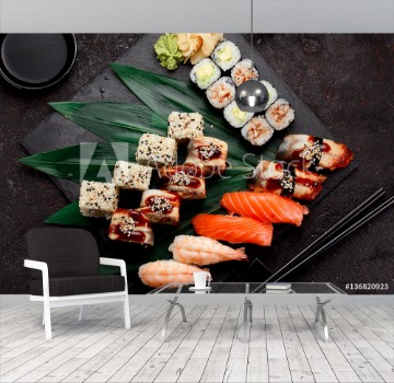 Image de Japanese cuisine Sushi set on a stone plate and dark concrete background